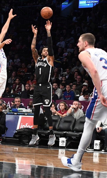 Russell scores 21, Nets defeat sloppy Sixers 122-97